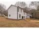 White two-story house with black trim and a deck at 684 Tarkington Rd, Stone Mountain, GA 30088