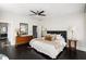 Main bedroom with plush bed and dark hardwood floors at 769 Penn Ne Ave, Atlanta, GA 30308