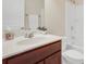 Clean bathroom, featuring a tub shower combo and wood vanity at 1209 Westgate Dr, Lilburn, GA 30047