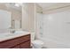 Clean bathroom with tub, shower, and wood vanity at 1209 Westgate Dr, Lilburn, GA 30047