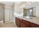 Elegant bathroom with double sinks, a large mirror and separate shower at 1209 Westgate Dr, Lilburn, GA 30047