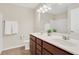 Bathroom boasts double vanity and a large mirror at 1209 Westgate Dr, Lilburn, GA 30047