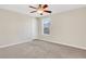 Bright bedroom featuring a ceiling fan and window at 1209 Westgate Dr, Lilburn, GA 30047