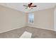 Bright bedroom featuring a large window and ceiling fan at 1209 Westgate Dr, Lilburn, GA 30047