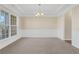 Spacious dining room with chandelier and wainscoting at 1209 Westgate Dr, Lilburn, GA 30047