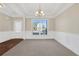 Bright dining room with a large window and chandelier at 1209 Westgate Dr, Lilburn, GA 30047