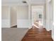 Bright hallway with hardwood floors and neutral walls at 1209 Westgate Dr, Lilburn, GA 30047