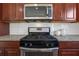 Stainless steel appliances and granite countertops in this kitchen at 1209 Westgate Dr, Lilburn, GA 30047