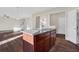 Modern kitchen island with granite countertops and hardwood floors at 1209 Westgate Dr, Lilburn, GA 30047