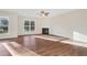 Large living room with hardwood floors, fireplace and ceiling fan at 1209 Westgate Dr, Lilburn, GA 30047