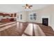 Spacious living room featuring hardwood floors and a fireplace at 1209 Westgate Dr, Lilburn, GA 30047