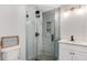 Modern bathroom with a frameless glass shower and grey marble tile at 363 Roselane Nw St, Marietta, GA 30060