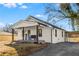 White cottage with covered porch, driveway and carport at 363 Roselane Nw St, Marietta, GA 30060