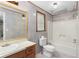 Bathroom with shower/tub and tiled walls at 390 Wayside Dr, Lawrenceville, GA 30046