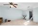 Spacious bedroom with light blue walls and ceiling fan at 390 Wayside Dr, Lawrenceville, GA 30046