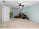 Spacious bedroom with light blue walls and ceiling fan at 390 Wayside Dr, Lawrenceville, GA 30046