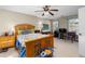 Well-lit bedroom with a wooden bed frame and dresser at 390 Wayside Dr, Lawrenceville, GA 30046