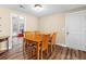 Simple dining area with a wooden table and four chairs at 390 Wayside Dr, Lawrenceville, GA 30046