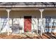 Front porch features a red door and grill at 390 Wayside Dr, Lawrenceville, GA 30046