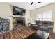 Living room features a large TV and a stone fireplace at 390 Wayside Dr, Lawrenceville, GA 30046