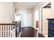 Upstairs hallway with dark hardwood floors and multiple doors at 830 Corsiglia, Marietta, GA 30060