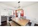 Dining room with rustic farmhouse table and chandelier at 102 Freedom Dr, Acworth, GA 30102