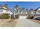 Two-story home with gray siding, stone accents, and driveway at 102 Freedom Dr, Acworth, GA 30102