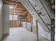 Unfinished basement with window and storage shelves at 2026 Morris Dr, Riverdale, GA 30296