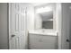 Bright bathroom with white vanity and a large mirror at 2026 Morris Dr, Riverdale, GA 30296