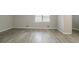 Large bedroom with hardwood floors and a window at 2026 Morris Dr, Riverdale, GA 30296