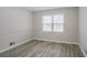 Bright bedroom with hardwood floors and large windows at 2026 Morris Dr, Riverdale, GA 30296