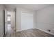 Well-lit bedroom with double doors and hardwood floors at 2026 Morris Dr, Riverdale, GA 30296