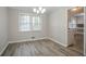 Bright dining room features hardwood floors and large windows at 2026 Morris Dr, Riverdale, GA 30296