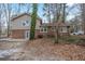 Side view of house with patio and trees at 2026 Morris Dr, Riverdale, GA 30296