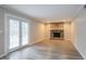 Gathering room with fireplace and French doors leading to the backyard at 2026 Morris Dr, Riverdale, GA 30296