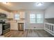 Updated kitchen with white cabinets and stainless steel appliances at 2026 Morris Dr, Riverdale, GA 30296