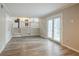 Bright living room with hardwood floors and kitchen view at 2026 Morris Dr, Riverdale, GA 30296