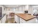 Modern kitchen with island, hardwood floors, and stainless steel appliances at 2295 Cloverdale Se Dr, Atlanta, GA 30316