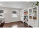 Living room with built-in shelving, hardwood floors, and a neutral color palette at 2295 Cloverdale Se Dr, Atlanta, GA 30316