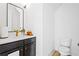 Elegant bathroom with dark vanity, marble countertops, and frameless shower at 330 Mount Zion Rd, Hapeville, GA 30354