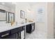 Elegant bathroom with double vanity, marble tile, and gold fixtures at 330 Mount Zion Rd, Hapeville, GA 30354