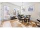 Kitchen dining area with glass table, hardwood floors, and access to the backyard at 330 Mount Zion Rd, Hapeville, GA 30354