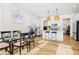 Modern white kitchen with island, stainless steel appliances, and hardwood floors at 330 Mount Zion Rd, Hapeville, GA 30354