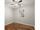 Bright bedroom featuring hardwood floors and ceiling fan at 3460 Fairlane Dr, Atlanta, GA 30331