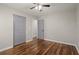 Bedroom with hardwood floors, ceiling fan, and double doors at 3460 Fairlane Dr, Atlanta, GA 30331