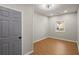 Cozy bedroom with hardwood floors and a gray accent wall at 3460 Fairlane Dr Dr, Atlanta, GA 30331