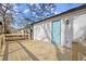 Newly stained deck with a teal door and railing at 3460 Fairlane Dr, Atlanta, GA 30331