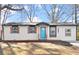 Charming ranch home with teal front door and updated siding at 3460 Fairlane Dr, Atlanta, GA 30331