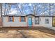 Newly renovated home with teal door and orange accents at 3460 Fairlane Dr Dr, Atlanta, GA 30331