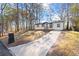 Ranch home with driveway and mature trees at 3460 Fairlane Dr, Atlanta, GA 30331